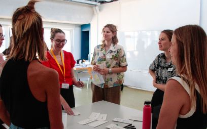 Moira Senti (center) led an interactive session in which participants used stories to examine inclusion in agriculture.