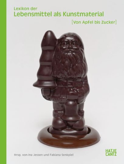 Cover des Buches «Lexikon der Lebensmittel als Kunstmaterial [Von Apfel bis Zucker]. Darauf ist ein Weihnachtmann aus Schokolade zu sehen.