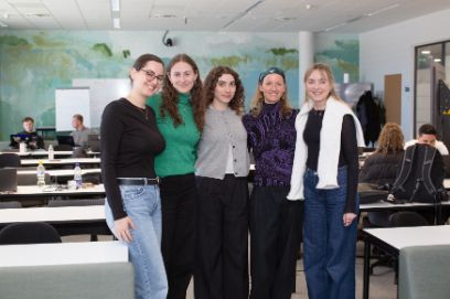 group of female students arm in arm